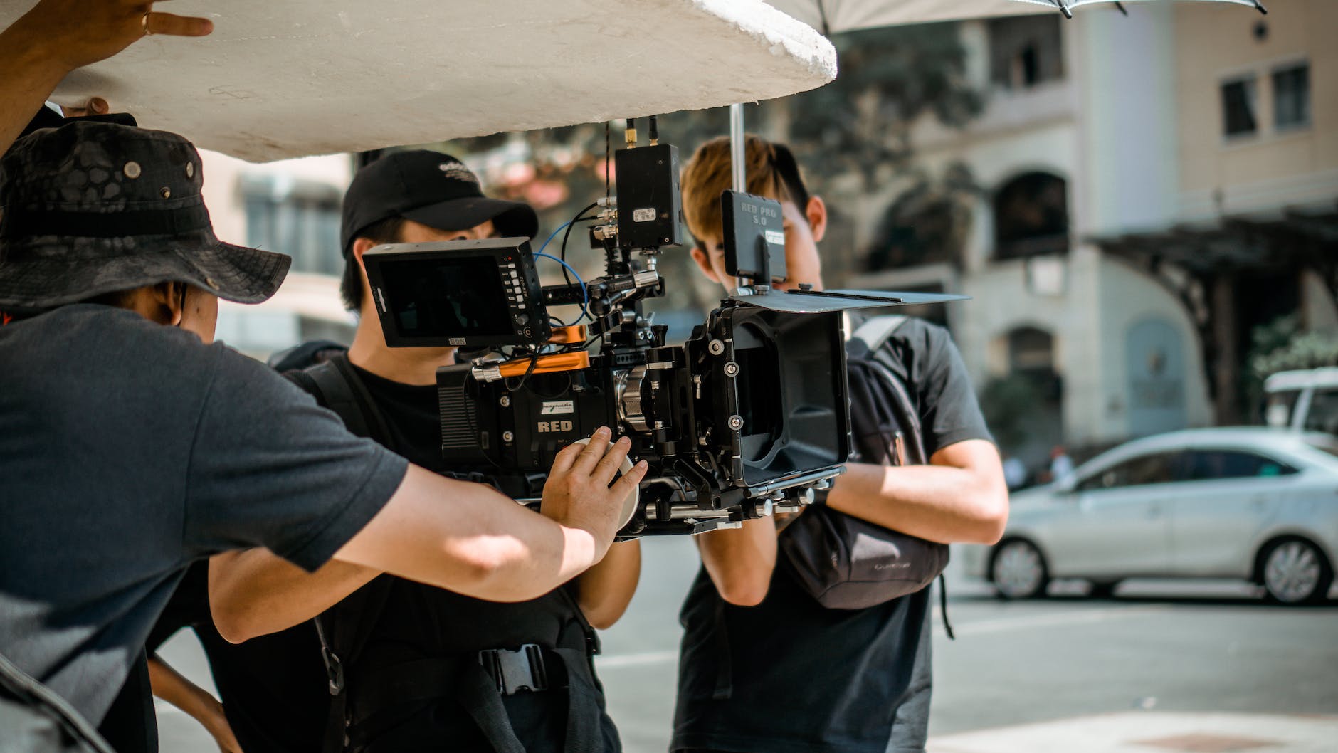 photo of man holding camera