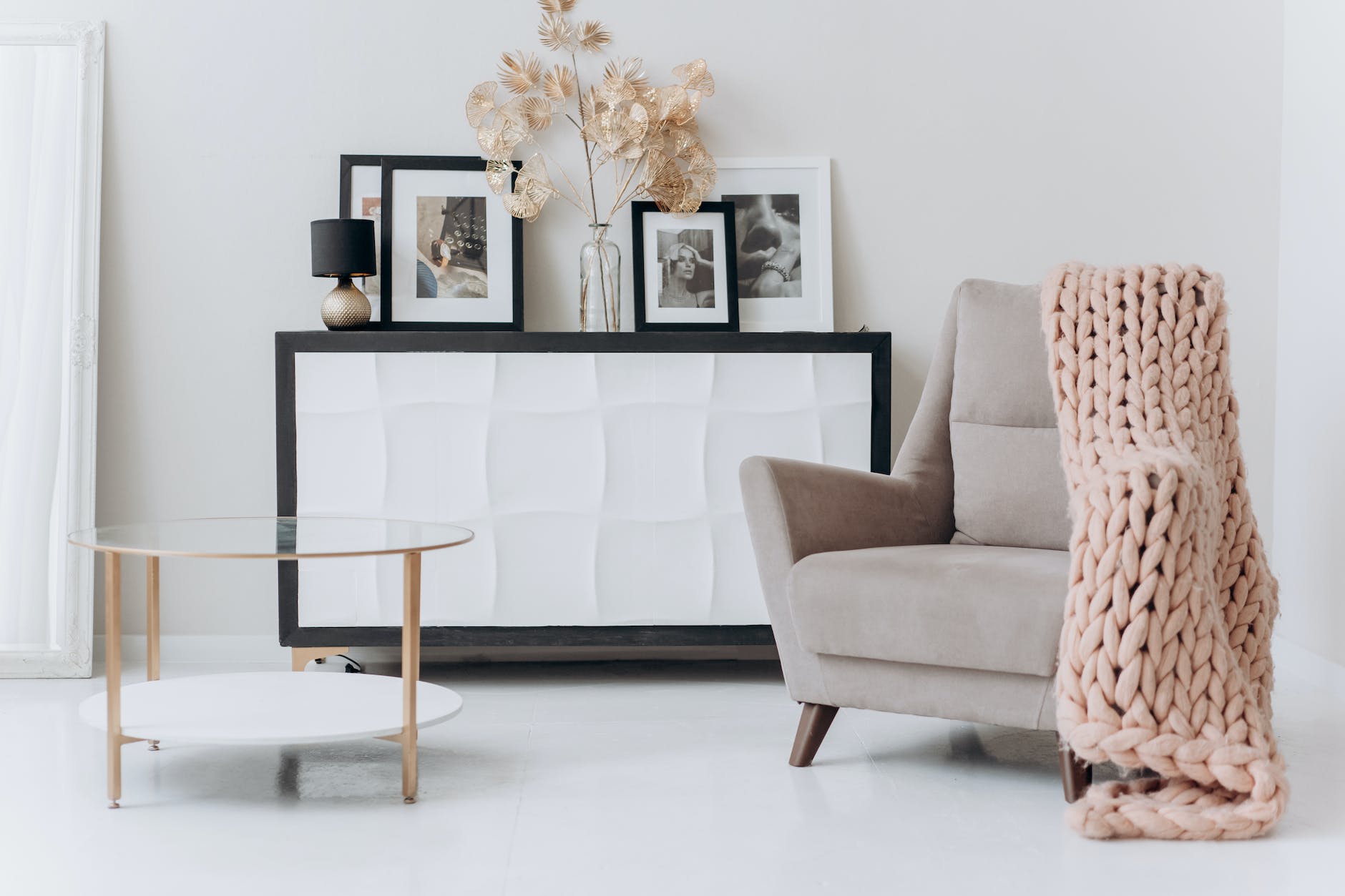 beige sofa chair near a table